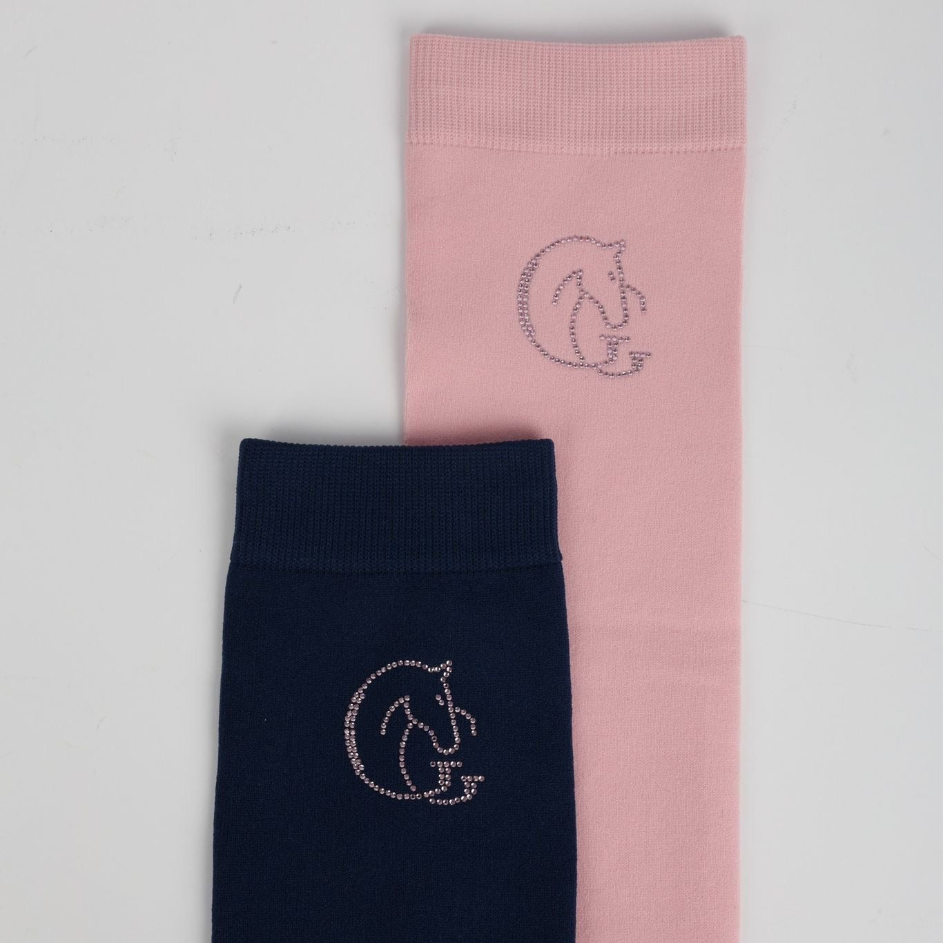 Two socks, one pink and one navy, with a logo on a light grey background