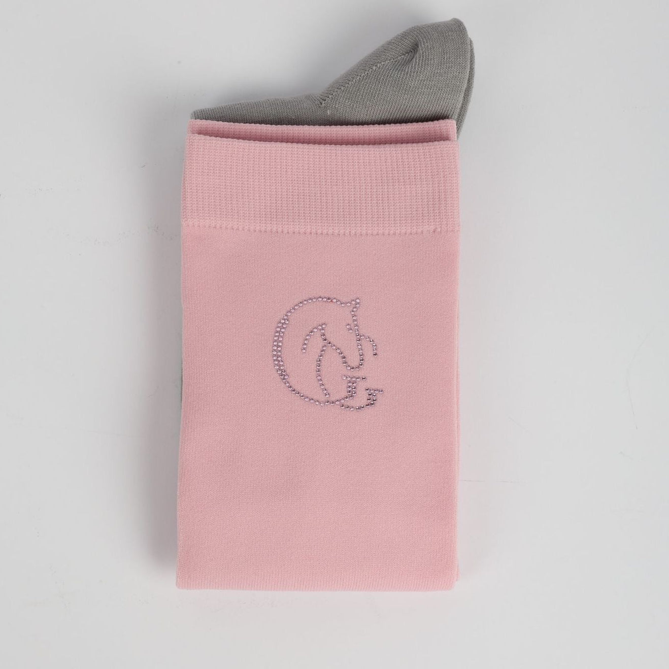 Pink sock with a logo on a light grey background
